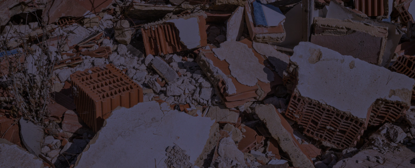 demolition debris of a house with some light brown bricks